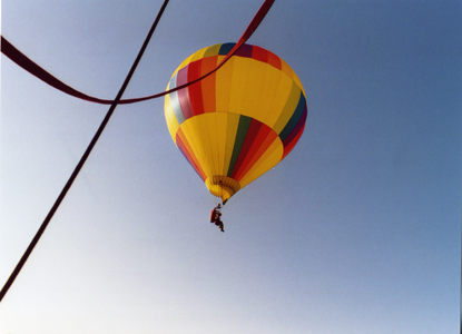 Open field situated behind a miniature golf and water-slide complex.