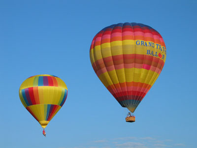 Open field situated behind a miniature golf and water-slide complex.