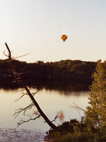 Drifting eastward over rural terrain.